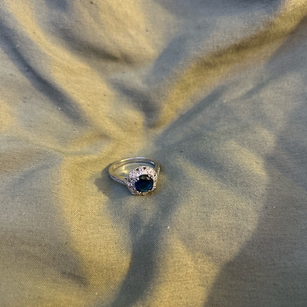 Elegant Silver Ring with Deep Blue Gem